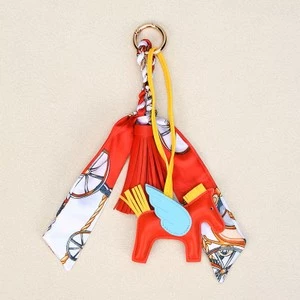 The Equine Warehouse Winged Horse Bag Charm - PU Leather Pendant with Ribbon - Red in Red